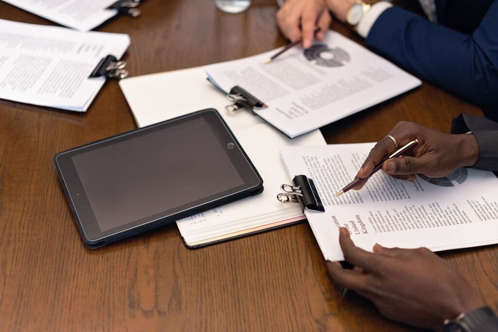 a close up shot of people reviewing documents